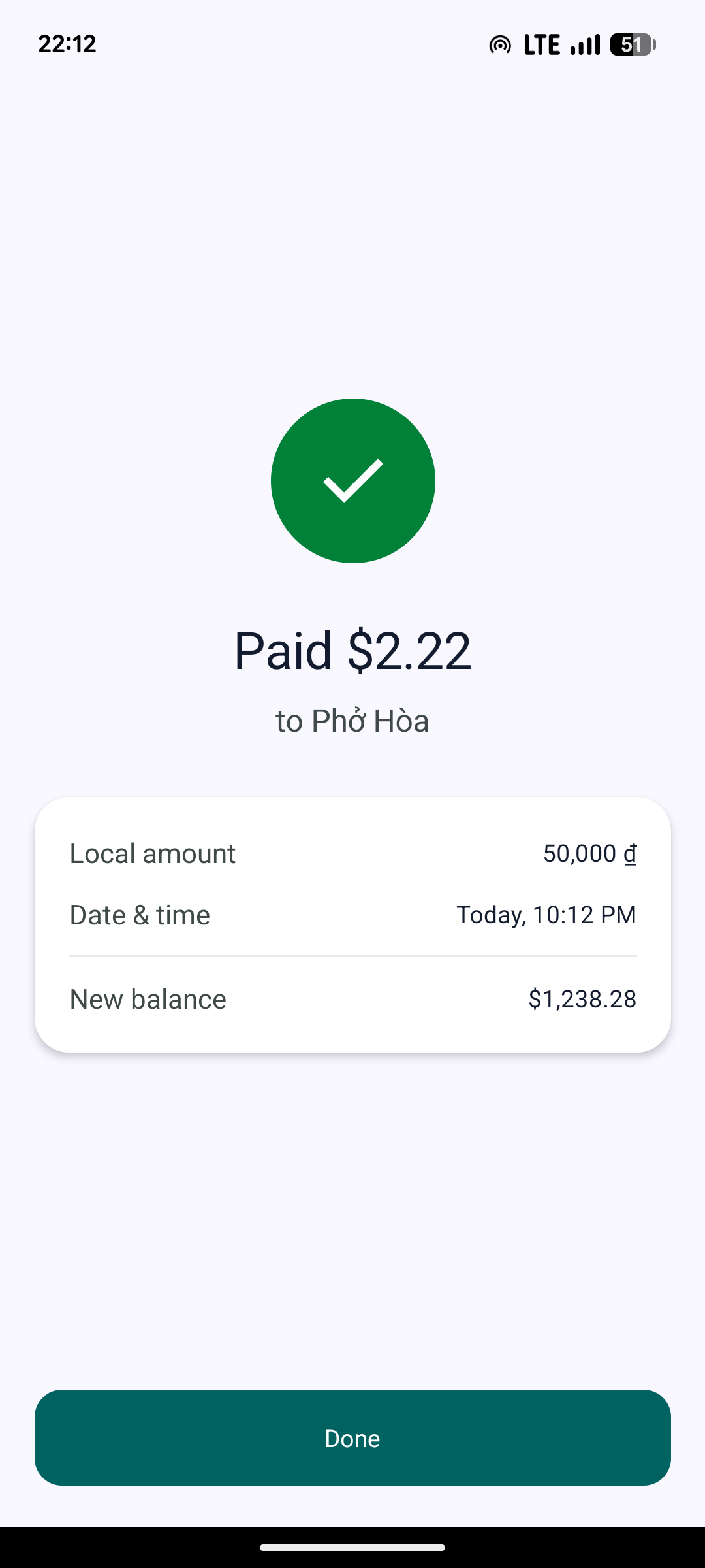 Valuto payment confirmed screen: paid $2.22 to Phở Hòa, with the local amount and new balance